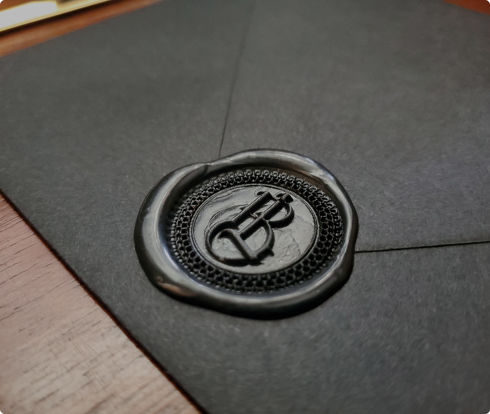 Black envelope with decorative black wax seal for intimate letters