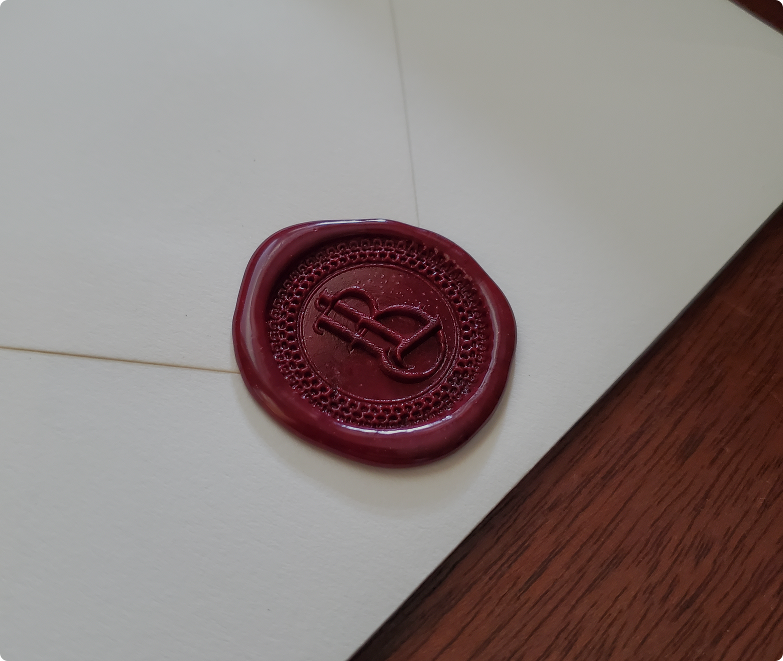 Cream envelope with decorative red wax seal for penpal letters